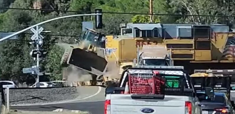 Watch Train Toss Tractor Like A Toy In Semi-Truck Collision